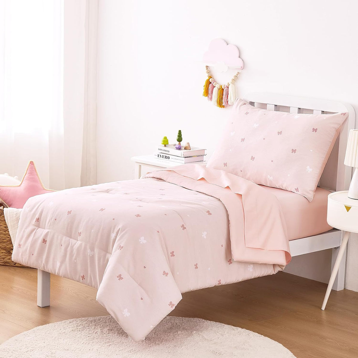 Wake In Cloud - Toddler Bedding Set for Girls, 100% Cotton Fabric, Cute Bow Heart Romantic Princess Style, 4 Pieces Soft Crib Bed Set Including Comforter, Sheets and Pillowcase, Pastel Pink